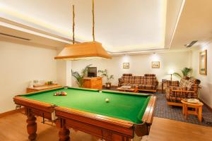 a living room with a pool table at Trident Chennai in Chennai