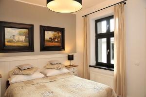 Posteľ alebo postele v izbe v ubytovaní Apartamenty Kopernika 14