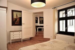 Posteľ alebo postele v izbe v ubytovaní Apartamenty Kopernika 14