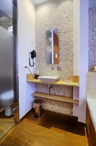 a bathroom with a sink and a mirror at Hotel Boutique Sabbia Valencia in Valencia