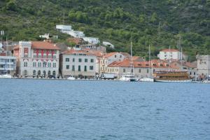 a town on the shore of a body of water at Apartment Diva in Vis