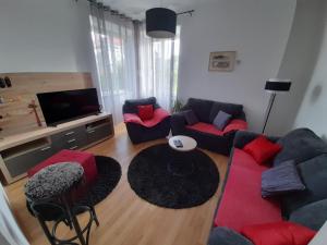 a living room with two couches and a television at Apartment Pavlito in Dubrovnik