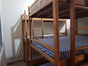 Postel nebo postele na pokoji v ubytování Casa de temporada Praia Grande