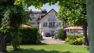 a view of a building from the garden at das Blum in Hagnau