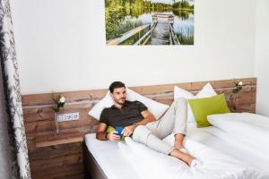 Ένα ή περισσότερα κρεβάτια σε δωμάτιο στο Huemer-Park Motel Vöcklatal