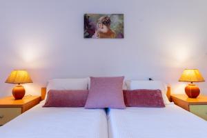 Posteľ alebo postele v izbe v ubytovaní Rivendell Apartments