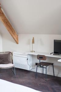 TV a/nebo společenská místnost v ubytování B'Guest Sleep & Retreat