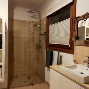 a bathroom with a shower and a sink at Strandmarken in Island Beach +77 photos