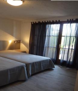 En eller flere senge i et værelse på La Villa faounzina