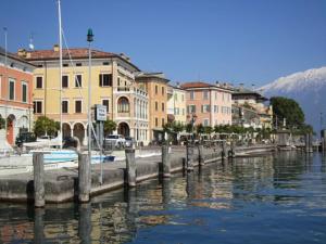 a group of buildings next to a body of water at Residenza Il Porto in Padenghe sul Garda