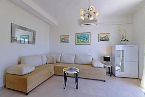 a living room with a couch and a table at Apartments Tamara in Hvar