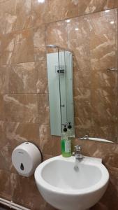 a bathroom with a sink and a mirror at Hostel Gagarin in Samara