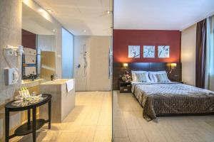 Posteľ alebo postele v izbe v ubytovaní Budapest Airport Hotel Stáció Wellness & Konferencia