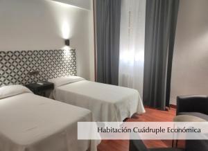 Postel nebo postele na pokoji v ubytování Hotel Montermoso