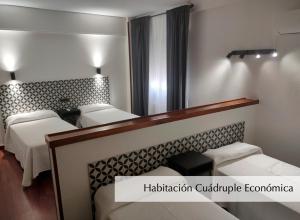 Postel nebo postele na pokoji v ubytování Hotel Montermoso