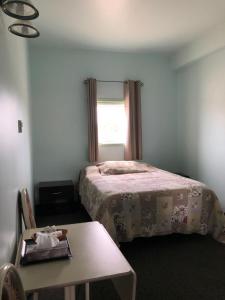 Postel nebo postele na pokoji v ubytování IceBerg Inn