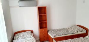 Postel nebo postele na pokoji v ubytování Gyöngyvendégház