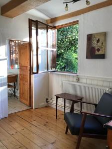 a living room with a table and a window at FeWo Jacob in Garlstorf