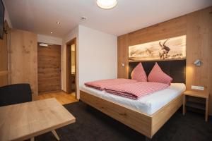 Postel nebo postele na pokoji v ubytování Haus Küchelspitz