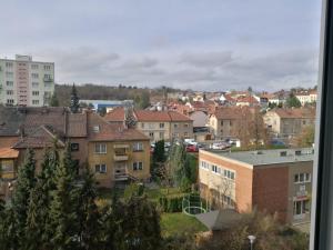 a view of a city with houses and buildings at Apartment Oltec in Bohunice
