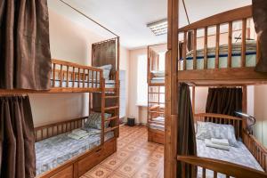 a room with three bunk beds in a hostel at Хостел Perron in Kharkiv