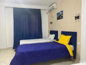 Postel nebo postele na pokoji v ubytování Hotel Métropole Résidence