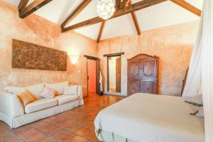 a living room with two beds and a couch at Casa La Ermita in Antigua Guatemala +34 photos