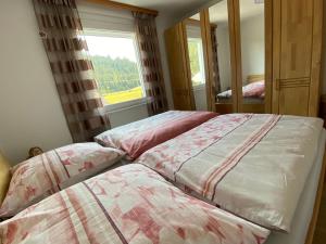 Postel nebo postele na pokoji v ubytování Traumhaus Flattnitz