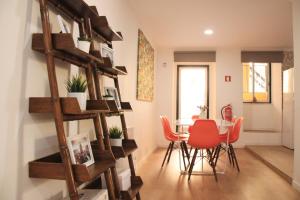 a room with a table and chairs in a room at RomanticHome at Alfama's Heart in Lisbon