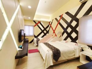 Кровать или кровати в номере Ai Lian Shan Shui Homestay