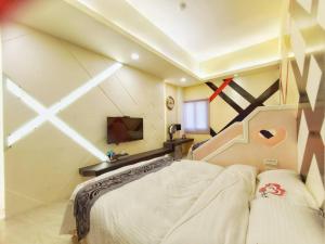 Кровать или кровати в номере Ai Lian Shan Shui Homestay