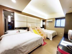 Кровать или кровати в номере Ai Lian Shan Shui Homestay