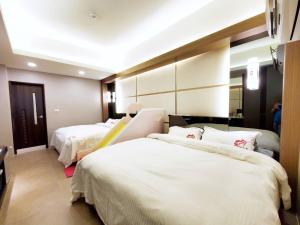 Кровать или кровати в номере Ai Lian Shan Shui Homestay