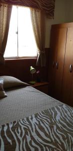 Hostal Tunquelen客房内的一张或多张床位