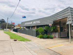 a truich hotel building on the side of a street at Horsham Motel in Horsham