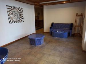 a room with three blue baskets on the floor at Mountain view Private apartments in Pirin Golf and SPA resort in Razlog