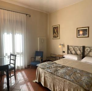 Кровать или кровати в номере Hotel De Prati
