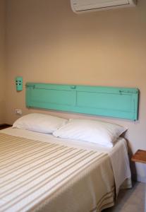 A bed or beds in a room at Corte Boero Bed&Breakfast