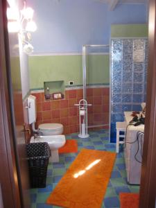 a bathroom with a toilet and a shower at Agriturismo PeterPan in Pietra Ligure