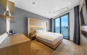 Postel nebo postele na pokoji v ubytování Sea Cruise Hotel + 37 fotografií