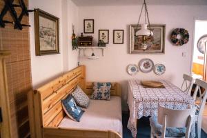 a dining room with a table and a table and chairs at U Mushera in Vrchlabí