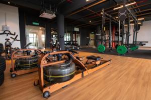 a gym with several treadmills and exercise equipment at Timurbay by Seascape in Kuantan