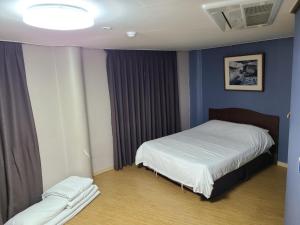 Ліжко або ліжка в номері Ora Stay Hotel