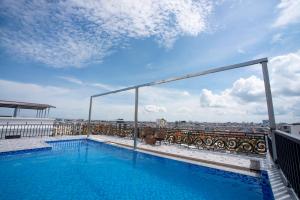 a swimming pool on the roof of a building at HM Hotel& Apartment in Hai Phong