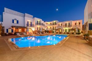 a large swimming pool in front of a building at Agios Prokopios Hotel in Agios Prokopios