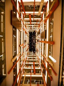 an empty hallway in a building with orange beams at Holiday Inn Kayseri - Duvenonu, an IHG Hotel in Kayseri