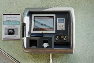 a self check in machine on a wall at Engelberg 24h check in in Wangen im Allgäu