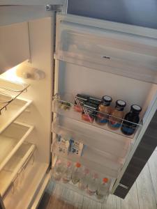an open refrigerator filled with lots of food and drinks at B&B Sant'Anna in Bari