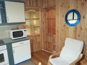 Kuchyň nebo kuchyňský kout v ubytování Czerwony Domek + 10 fotografií