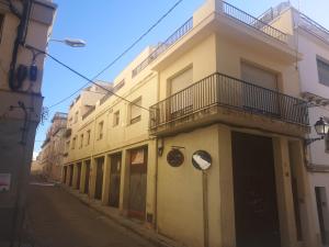 a row of buildings on the side of a street at Apartamento duplex vacacional in Arenys de Mar